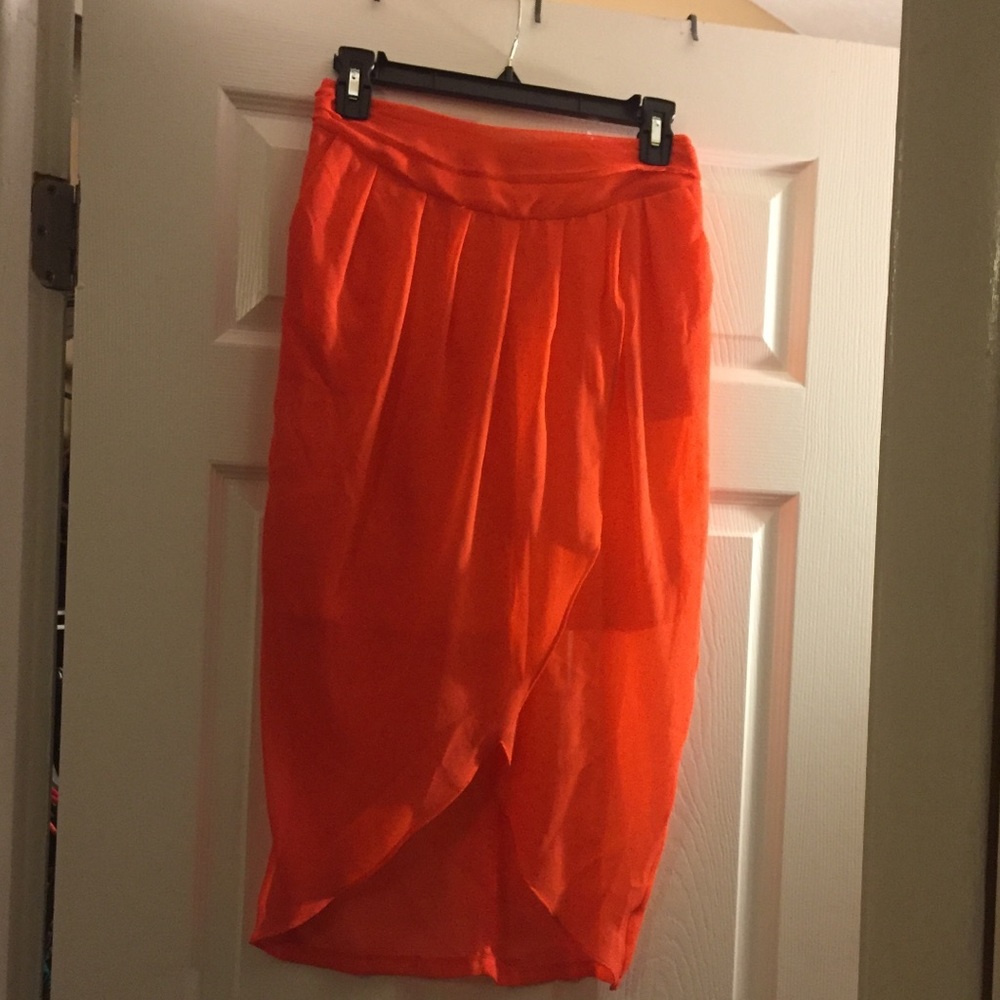 Orange asymmetrical skirt with pockets